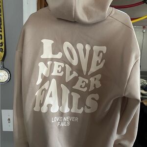 Love Never Fails Tan Hoodie